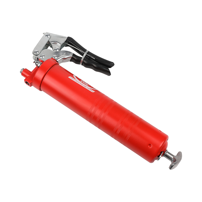 Pistol grip grease gun with flexible hose