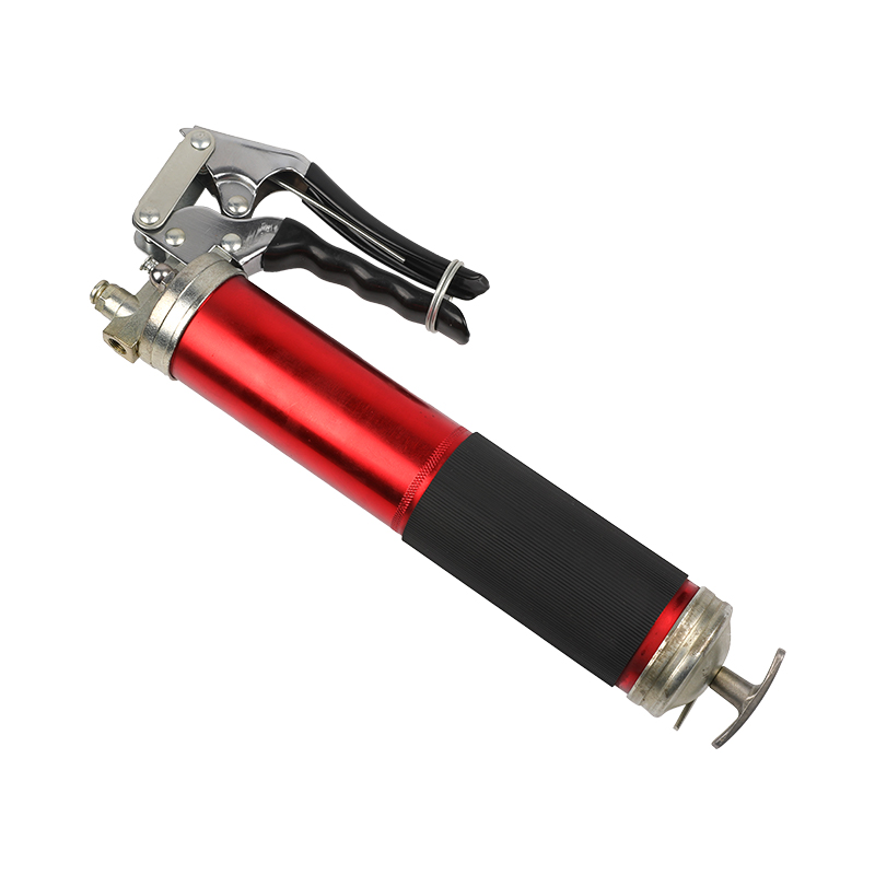 Pistol grip grease gun with flexible hose